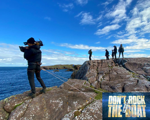 Camera man safety on cliff edge. 