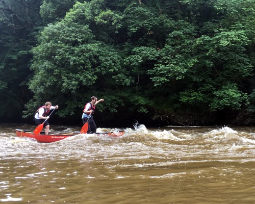 Standing in Canoe through rapid