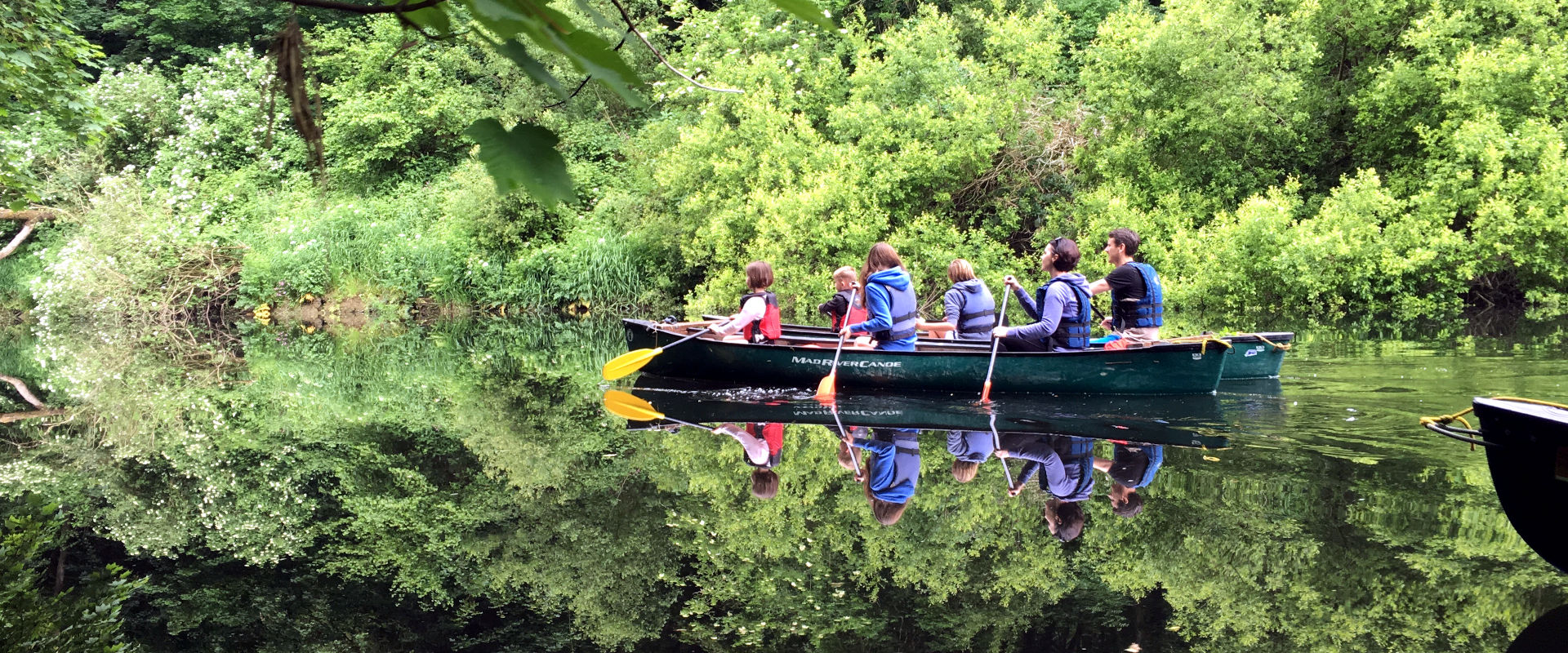 Family canoe trip through Teifi Gorge near Cardigan